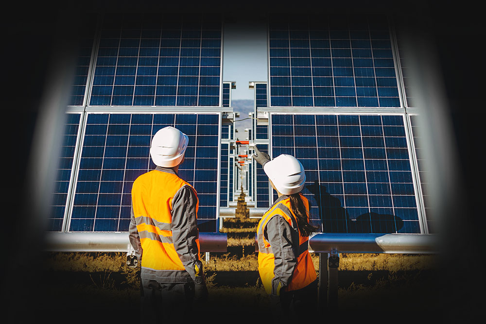 Engineers in the field with solar panels